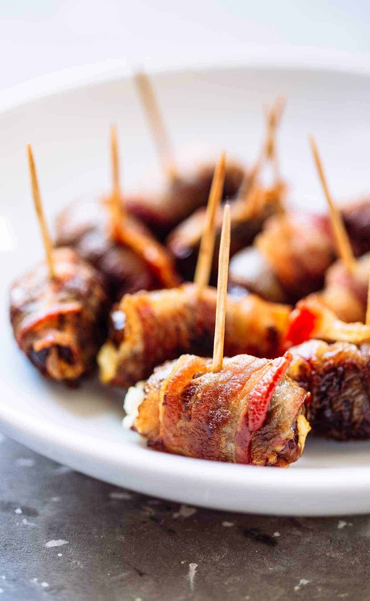 Bacon Wrapped Dates with Goat Cheese - a super easy 3-ingredient appetizer recipe that will blow you away! | pinchofyum.com