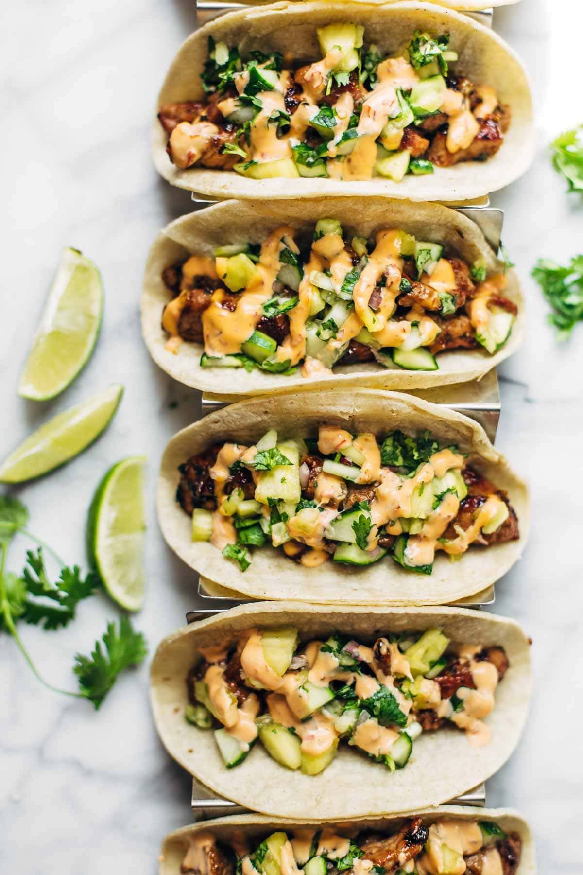 Caramelized Pork Tacos with Pineapple Salsa - topped with sriracha mayo, obviously. ♡ quick and easy to make - LOVE this recipe! | pinchofyum.com