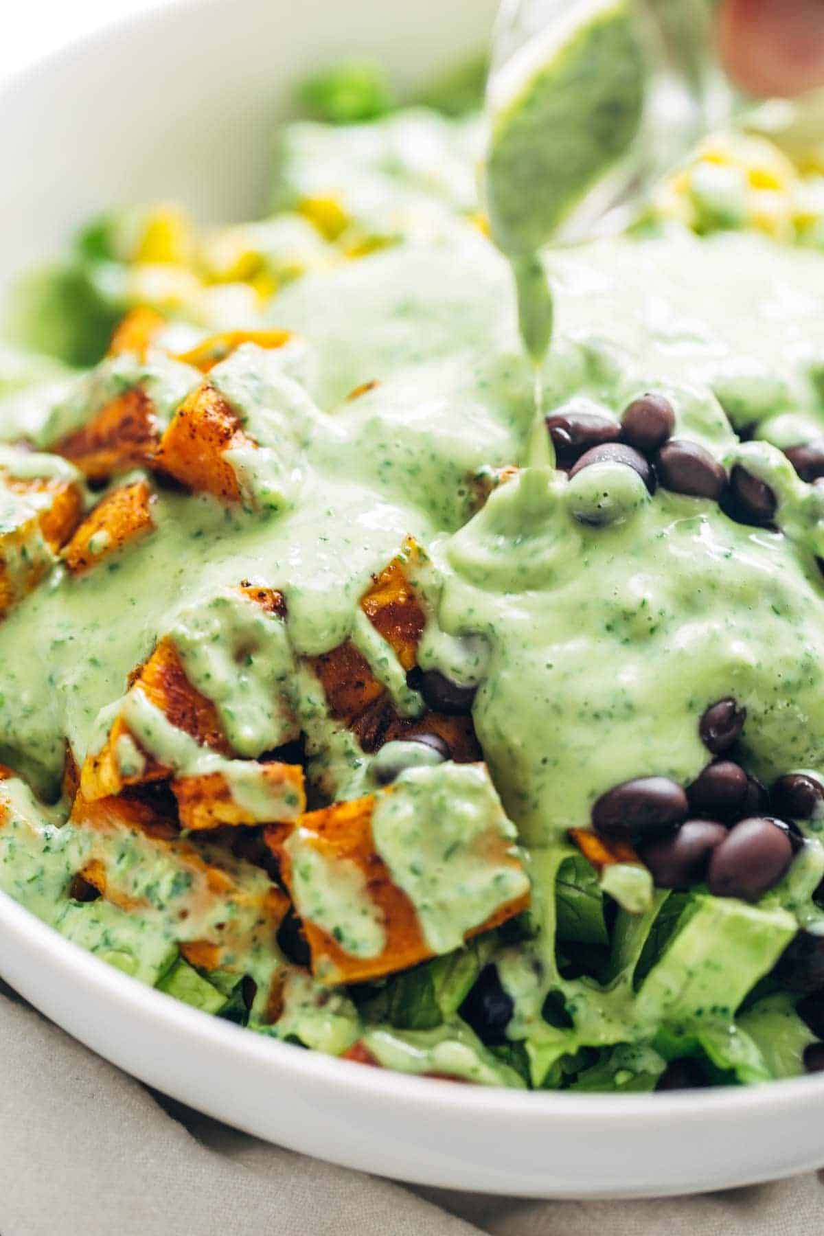 Cilantro Avocado Dressing - so easy and it goes on anything! made with simple ingredients like cilantro, avocado, Greek yogurt, garlic, and lime juice. LOVE! | pinchofyum.com