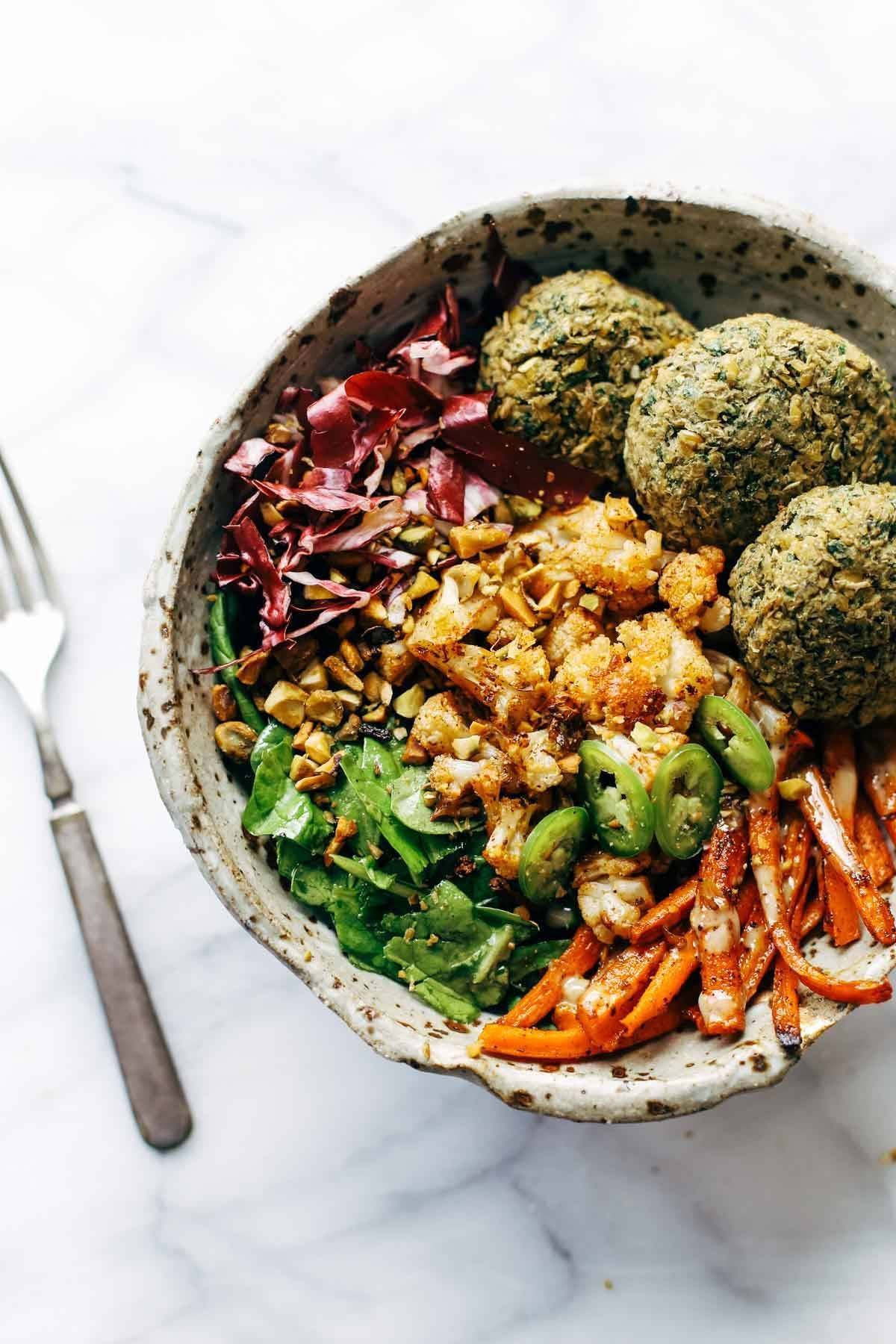 Eat well AND keep your glow all through winter! Easy homemade falafel, roasted veggies, and flavorful sauce all in one big bowl! vegetarian / vegan / gluten free recipe. | pinchofyum.com