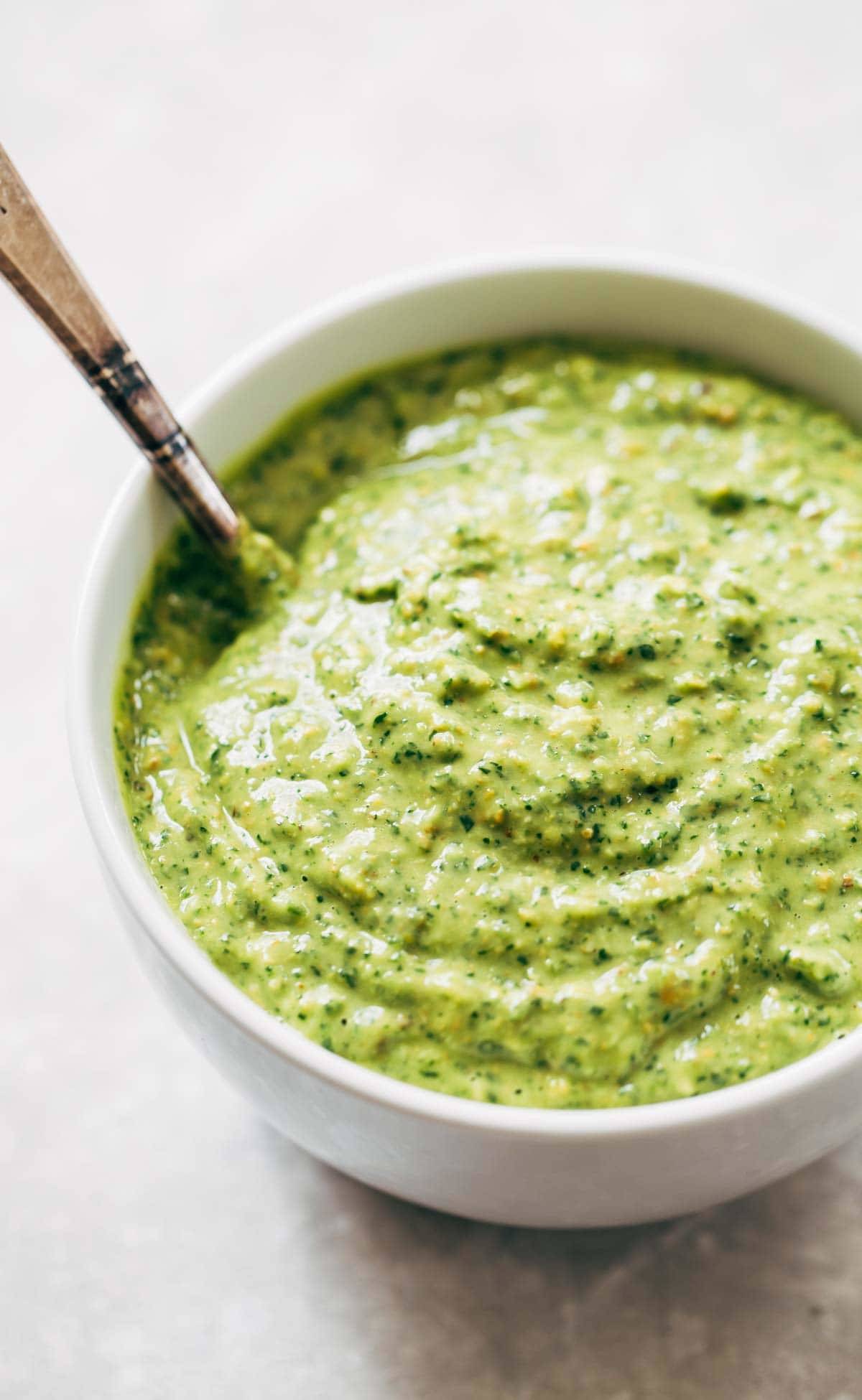 5 Minute Magic Green Sauce - this sauce goes with anything as a dip, dressing, marinade, or spread! Easy ingredients like avocado, parsley, cilantro, garlic, and lime. Vegan! 