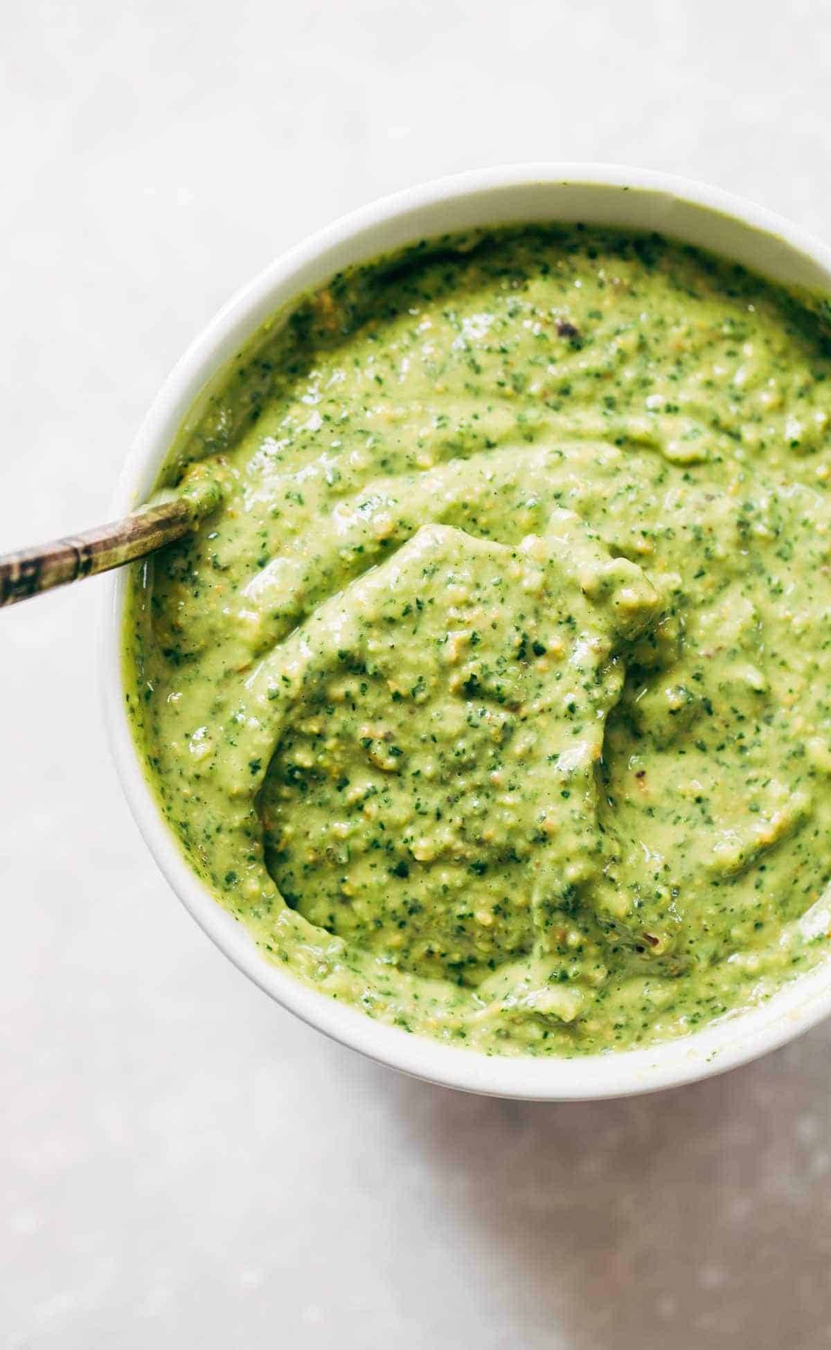 5 Minute Magic Green Sauce - use on salads, with chicken, or just as a dip! Easy ingredients like parsley, cilantro, avocado, garlic, and lime. Vegan! 