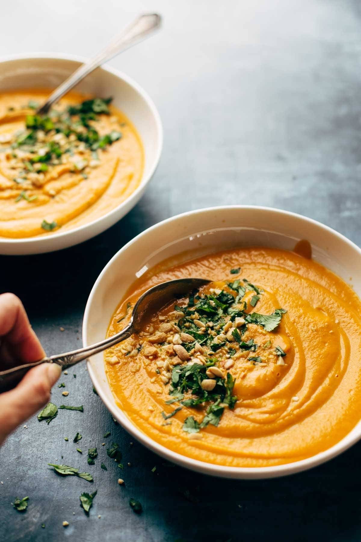 Spicy Vegan Carrot Soup made with coconut milk, onions, carrots, garlic, and curry paste. Easy, vegan, gluten free, awesome. | pinchofyum.com