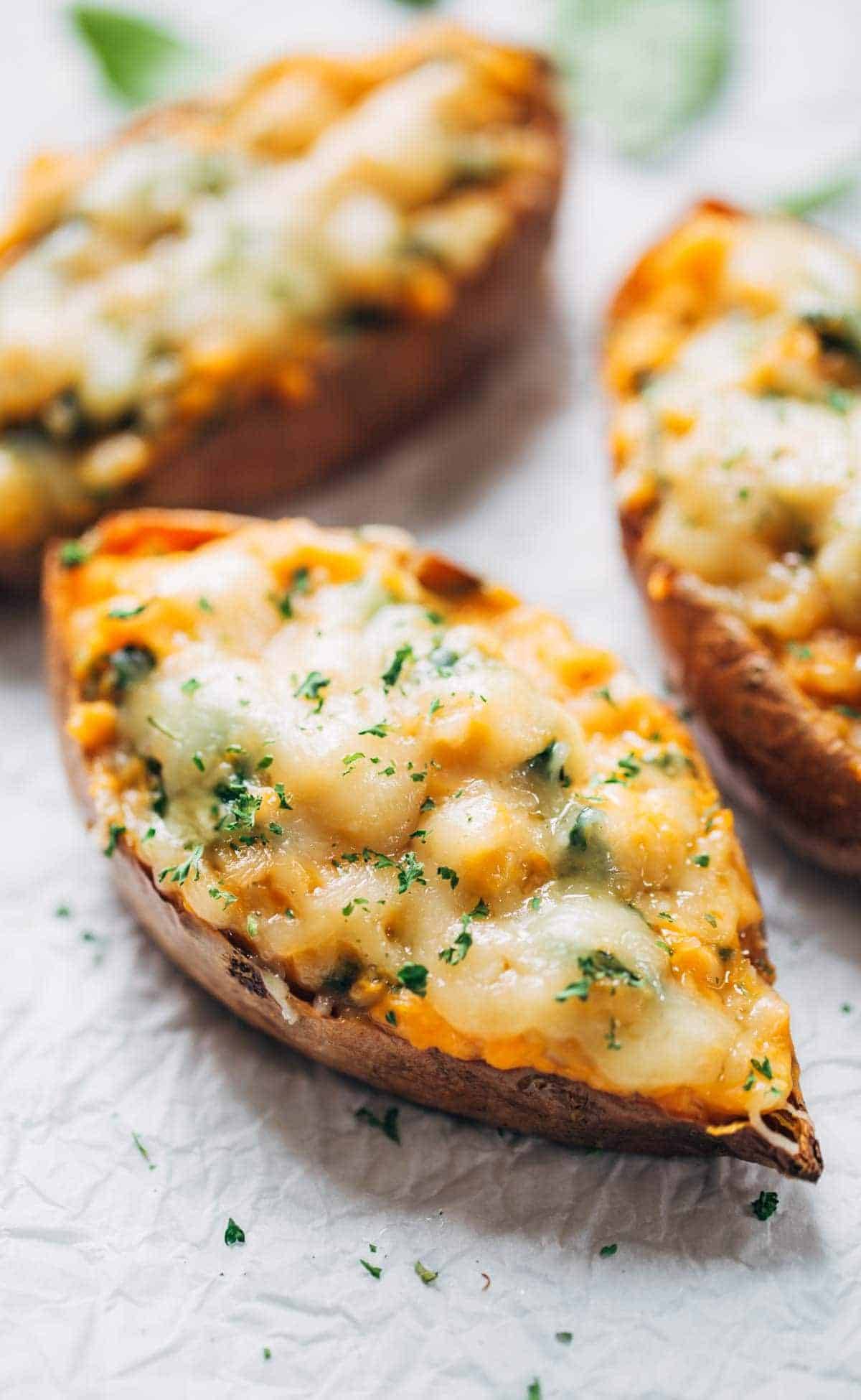 Healthy Sweet Potato Skins recipe: stuffed with a creamy spinach filling and covered with melted cheese. A must-try for sweet potato lovers! | pinchofyum.com