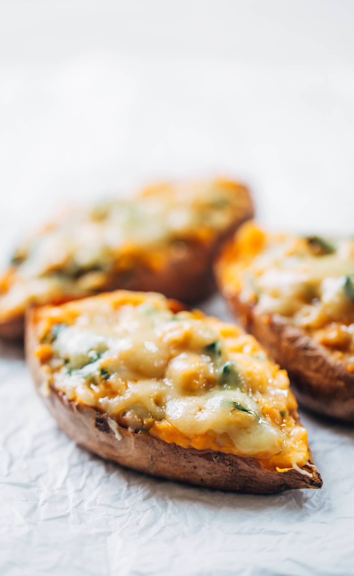 Healthy Sweet Potato Skins recipe - stuffed with a creamy spinach filling and covered with melted cheese. Yum! | pinchofyum.com